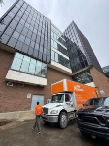 Virk Movers truck parked outside a commercial building, ready to provide reliable office and commercial moving services.